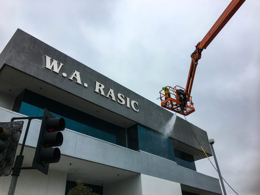 Pressure washing commercial building