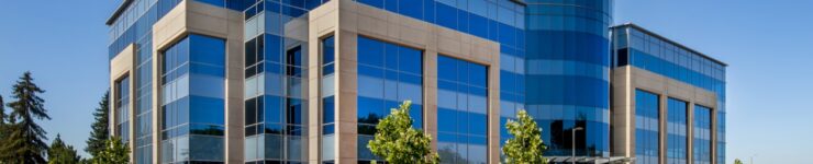 Exterior view of a commercial office building with large glass windows